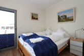 Seltene Gelegenheit in Heiligenhafen – Exklusive Ferienwohnung mit traumhaftem Wasserblick - Schlafzimmer