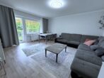 Wohnen auf zwei Ebenen mit eigenem Garten und sonniger Terrasse - Wohnzimmer