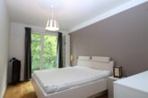 Luxuriös möblierte Neubauwohnung mit Balkon, Designküche & Top-Lage - Schlafzimmer