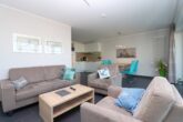Exklusive Ferienwohnung mit traumhaftem Wasserblick - Wohnzimmer